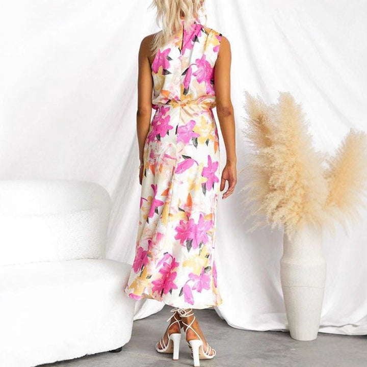 Kvinnors maxiklänning med asymmetrisk topp och blommönster Mirla-Eva Jonsson