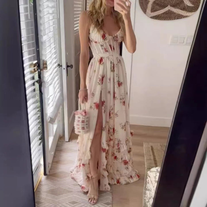 Kvinnors maxiklänning med blommiga volangdetaljer och högslits-Eva Jonsson