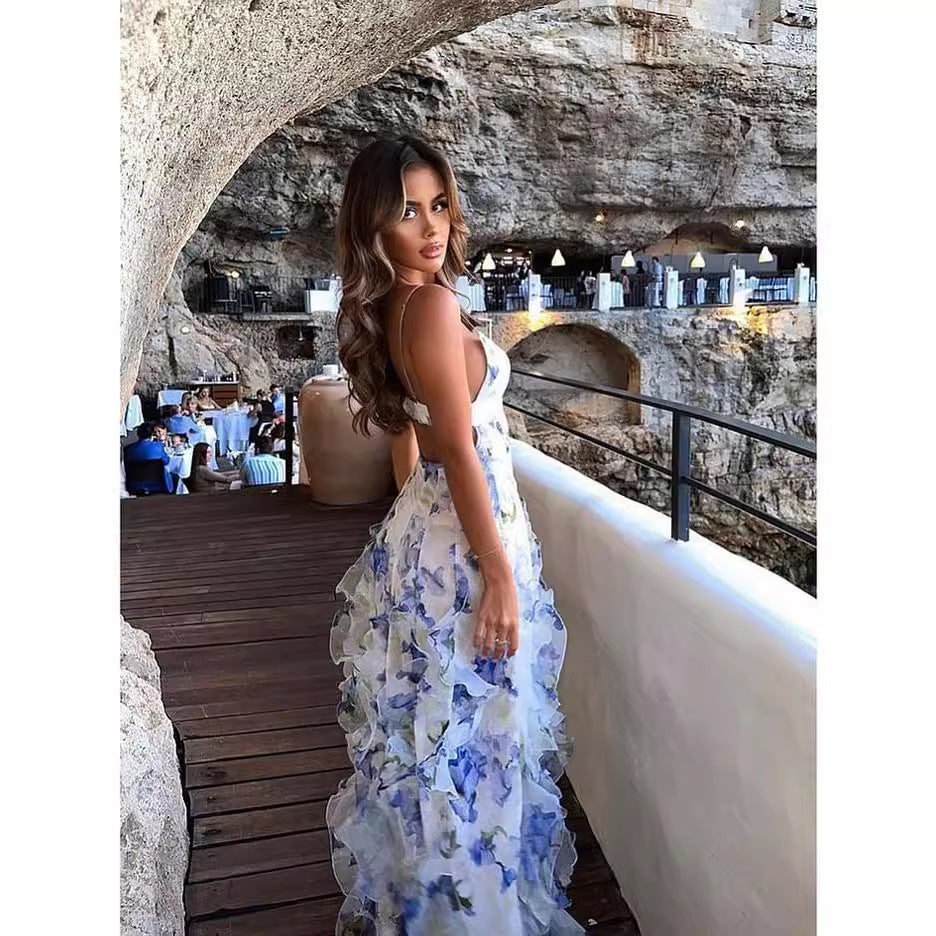 Kvinnors maxiklänning med blommiga volanger och flödande nederkant-Eva Jonsson