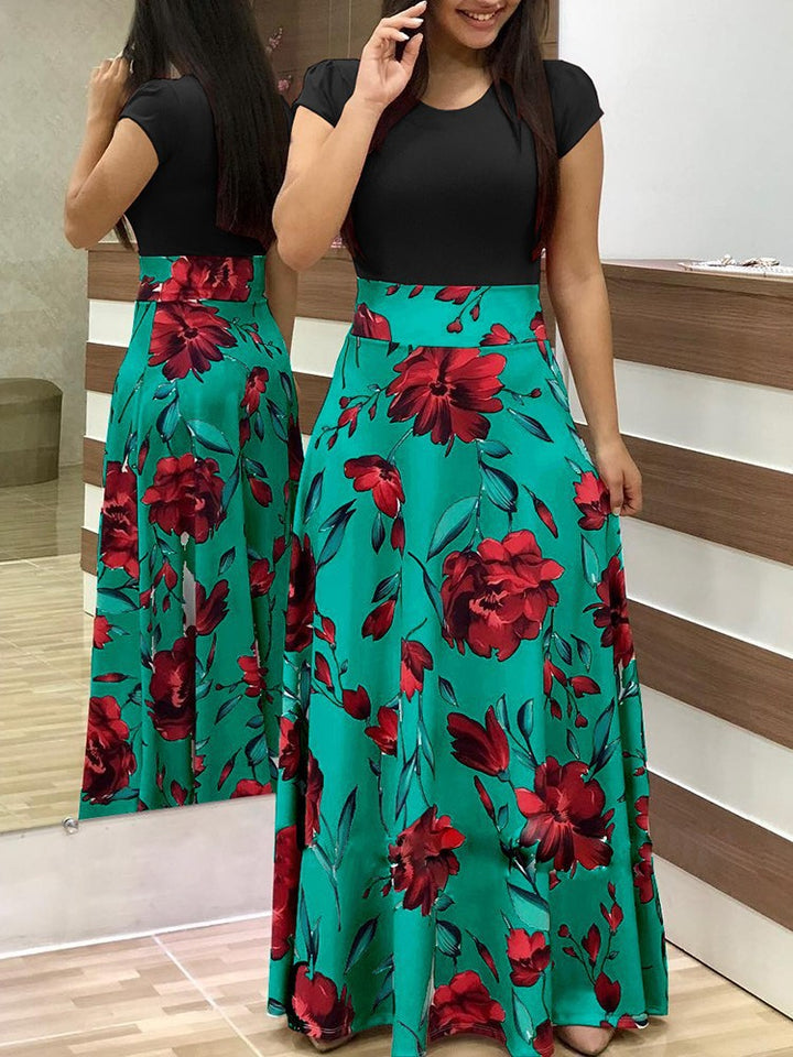 Kvinnors maxiklänning med blommotiv och elastisk midja Mirla-Eva Jonsson