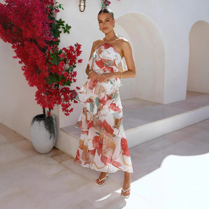 Kvinnors maxiklänning med elegant överdrag och blommiga volanger Mirla-Eva Jonsson