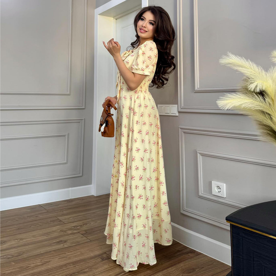 Kvinnors maxiklänning med elegant rosett och romantiskt blommönster Mirla-Eva Jonsson