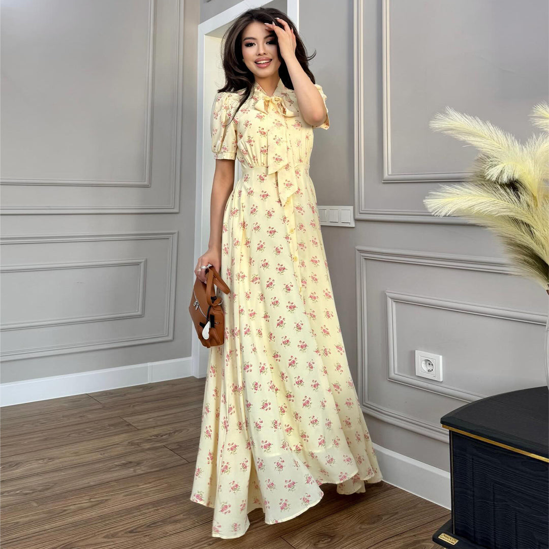 Kvinnors maxiklänning med elegant rosett och romantiskt blommönster Mirla-Eva Jonsson