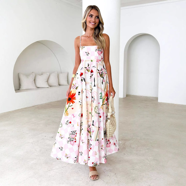 Kvinnors maxiklänning med eleganta remmar och blommiga detaljer Mirla-Eva Jonsson