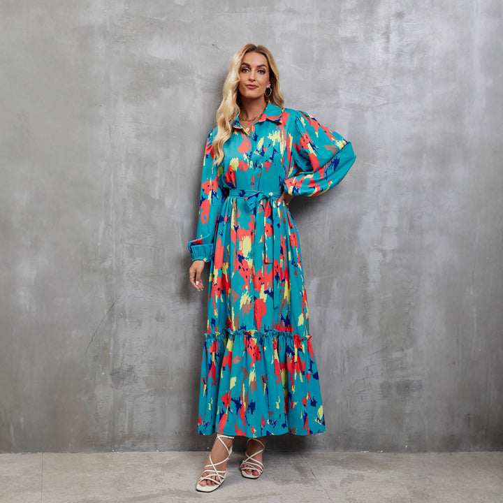Kvinnors maxiklänning med färgglad blommig design och elegant midjebälte-Eva Jonsson