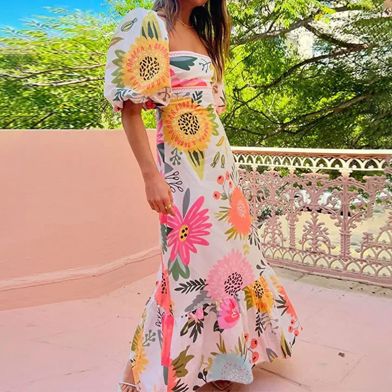 Kvinnors maxiklänning med puffärmar och blommönster detaljer Mirla-Eva Jonsson