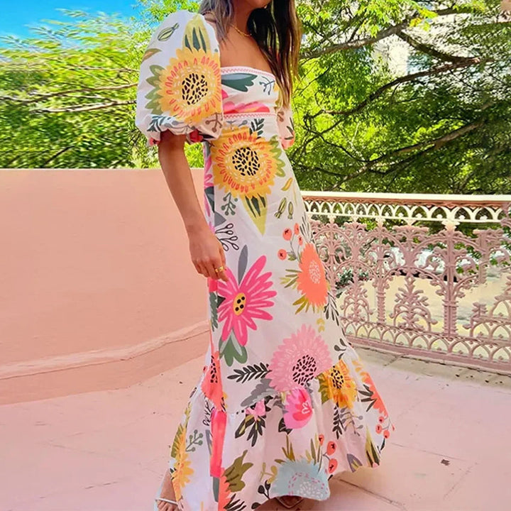 Kvinnors maxiklänning med puffärmar och blommönster detaljer Mirla-Eva Jonsson