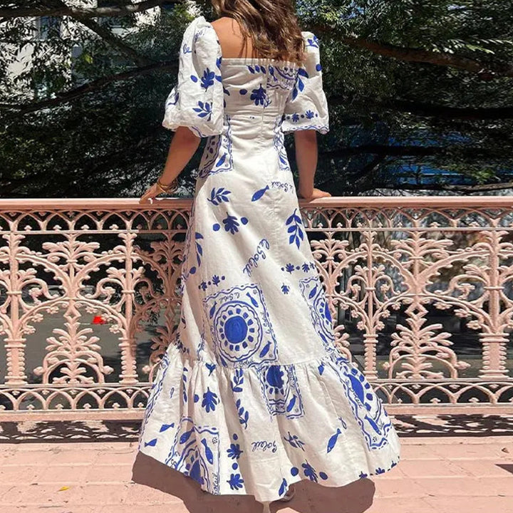 Kvinnors maxiklänning med puffärmar och blommönster detaljer Mirla-Eva Jonsson