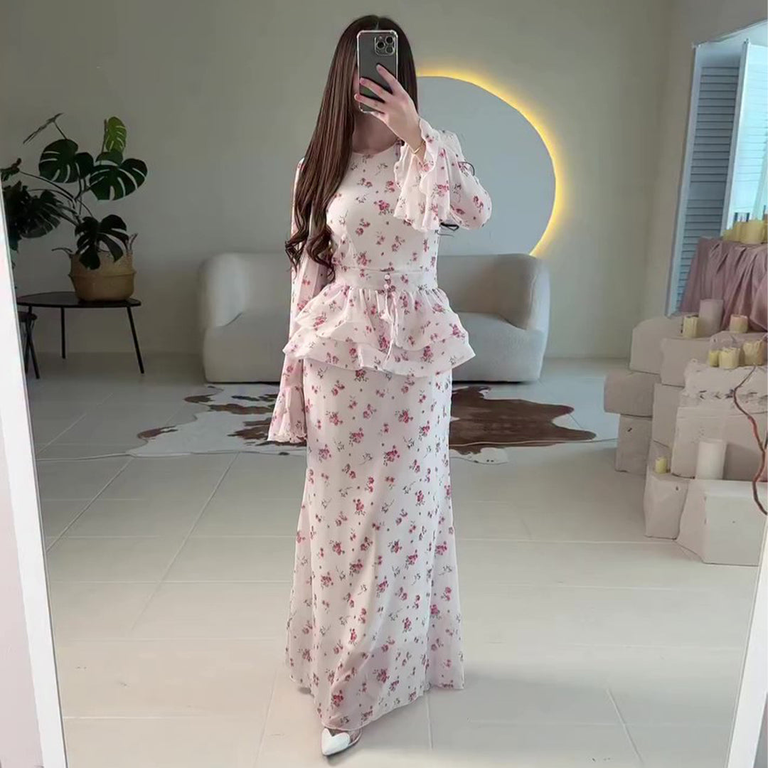 Kvinnors maxiklänning med voluminös peplum och blommiga detaljer-Eva Jonsson
