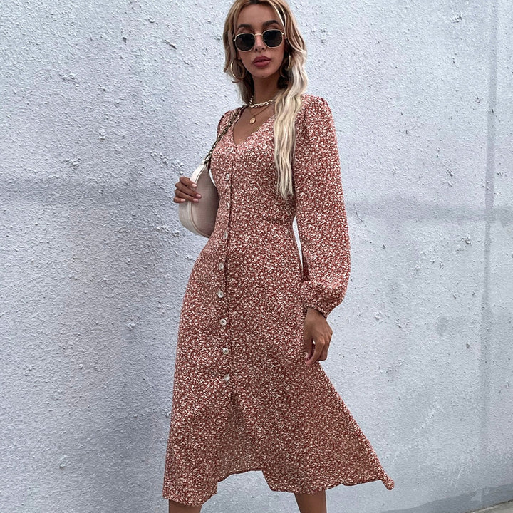 Kvinnors midi klänning med blommönster och elegant knapdesign Mirla-Eva Jonsson