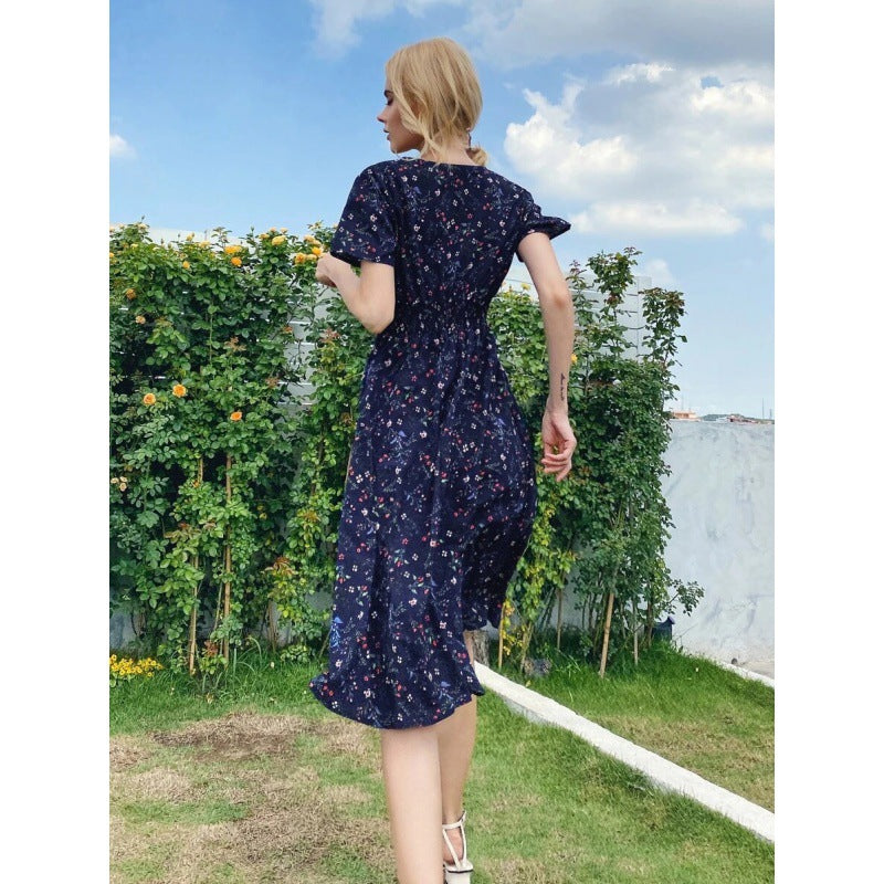 Kvinnors midi klänning med blommönster och svängd nederkant Mirla-Eva Jonsson