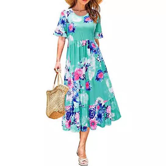 Kvinnors midi-klänning med blommönster och volangslipning Mirla-Eva Jonsson
