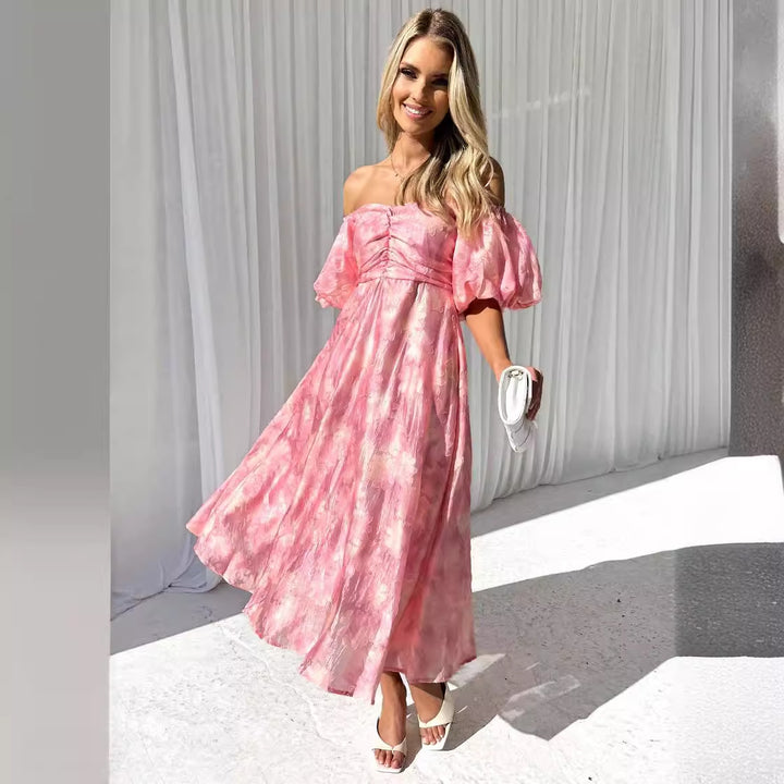 Kvinnors midi-klänning med puffärmar och blommönster Mirla-Eva Jonsson