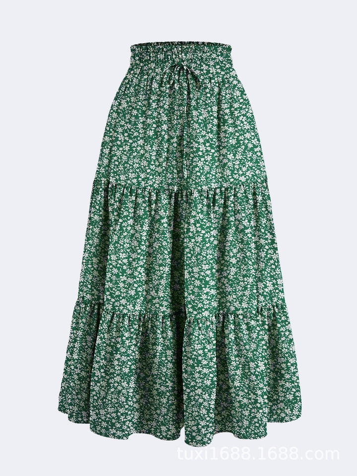Kvinnors midijurk med elastiskt midjeband och blommönster Mirla-Eva Jonsson