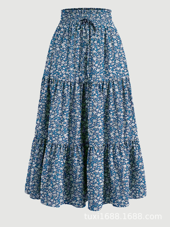 Kvinnors midijurk med elastiskt midjeband och blommönster Mirla-Eva Jonsson