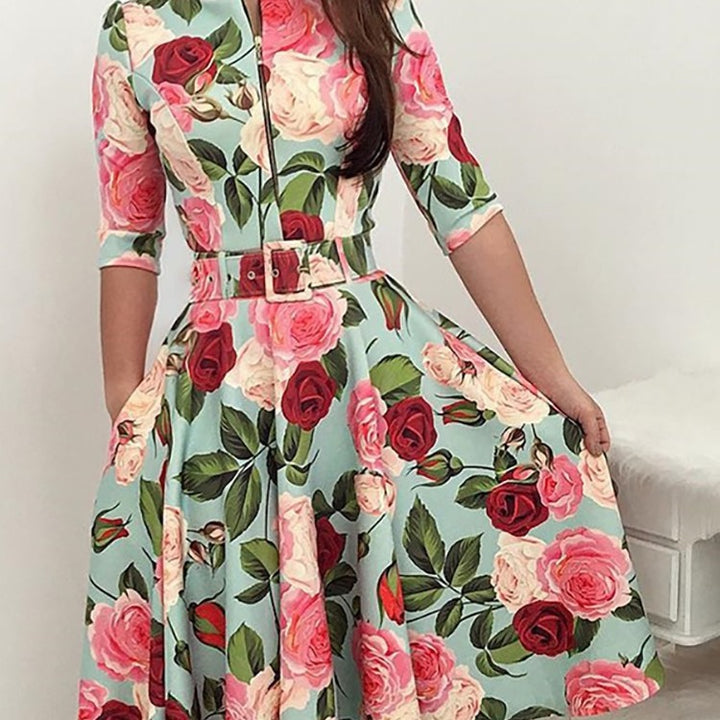 Kvinnors midikjol med blommönster och midjebälte Mirla-Eva Jonsson