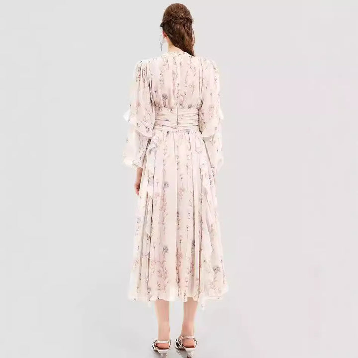 Kvinnors midikjolklänning med blommönster och elegant volangslut Mirla-Eva Jonsson