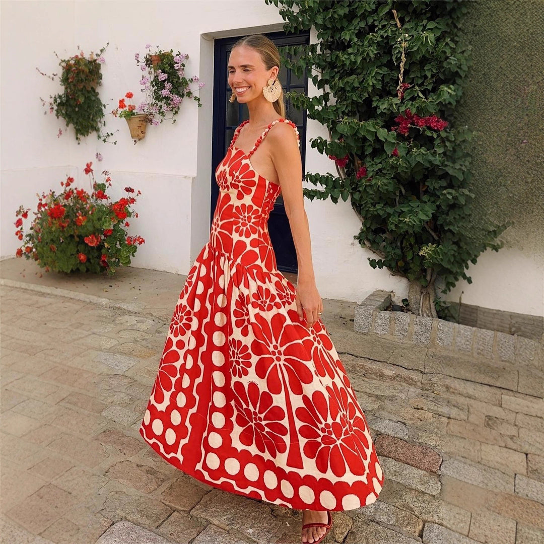 Kvinnors midiklänning med blommönster och spaghettiband Mirla-Eva Jonsson