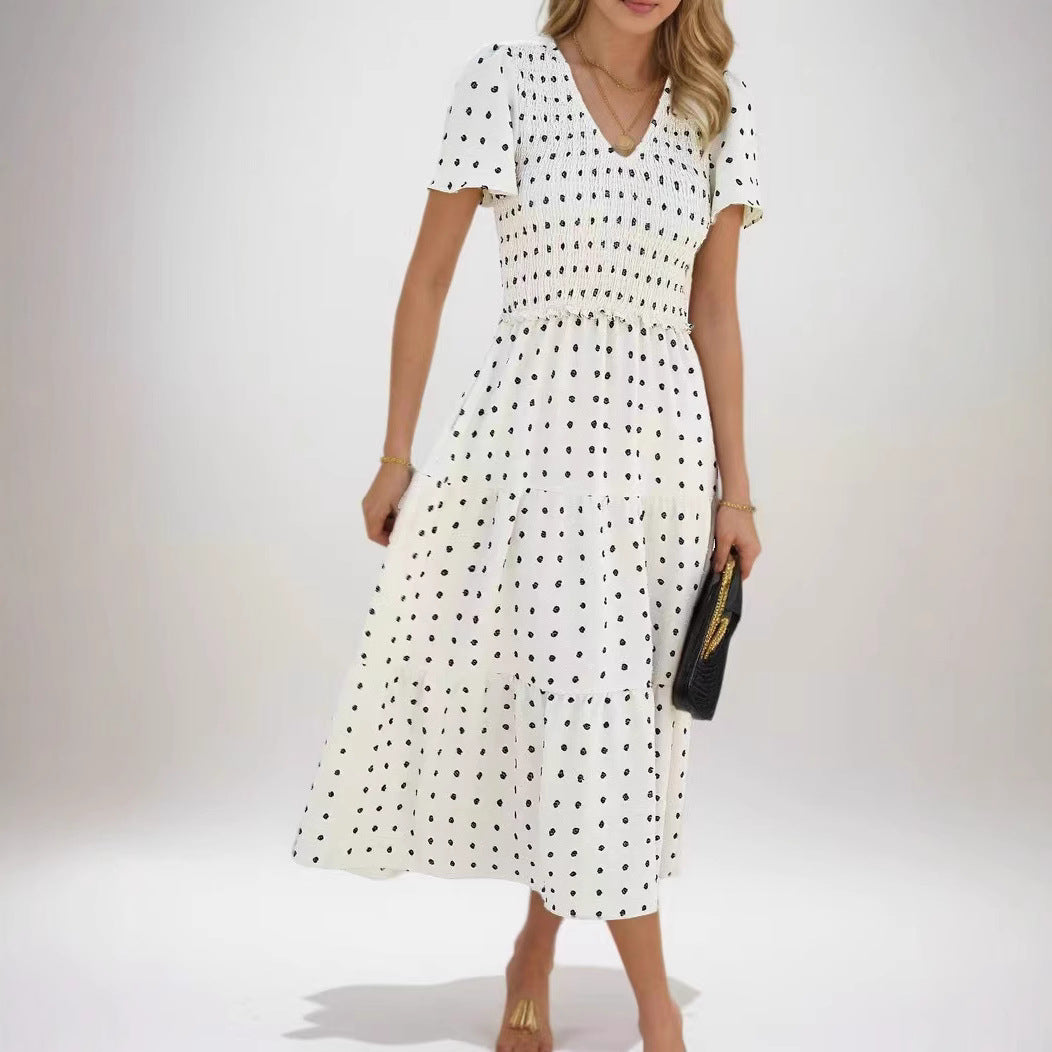 Kvinnors midiklänning med elastisk midjeband och volangdetaljer Mirla-Eva Jonsson