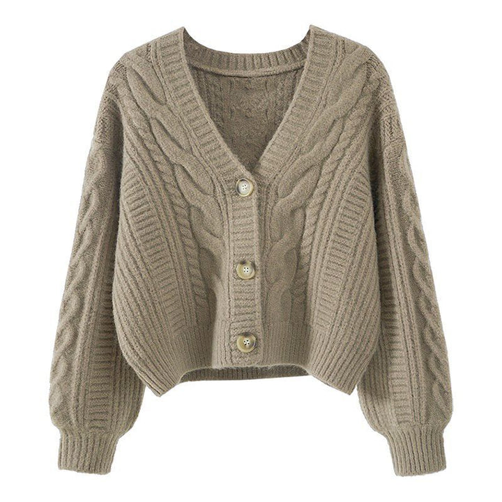 Kvinnors mode cardigan med kabelstickat mönster och extravaganta knappar Detaljer Mirla-Eva Jonsson