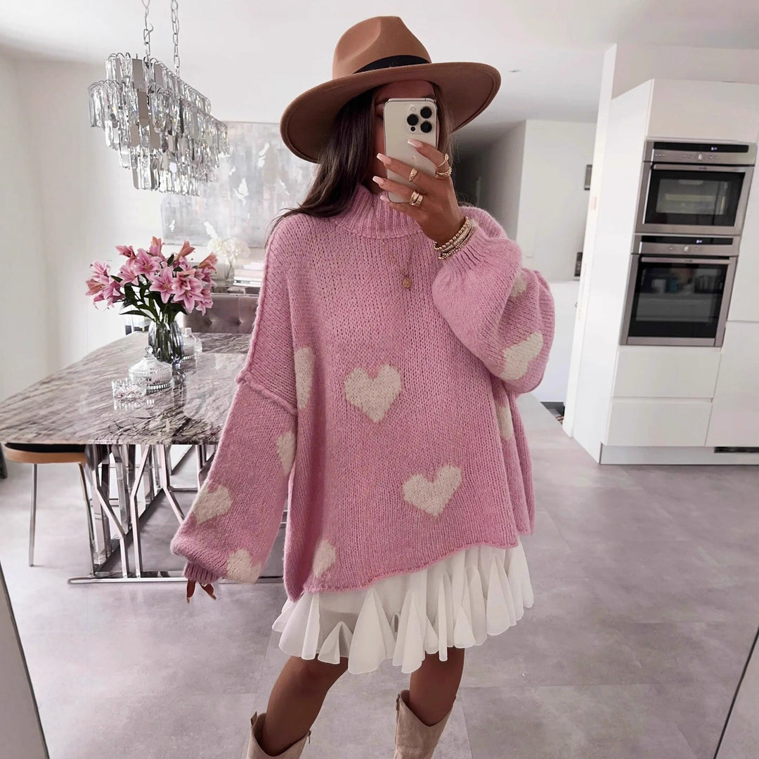 Kvinnors mode oversized tröja med hjärtformat mönster och voluminösa ärmar Mirla-Eva Jonsson