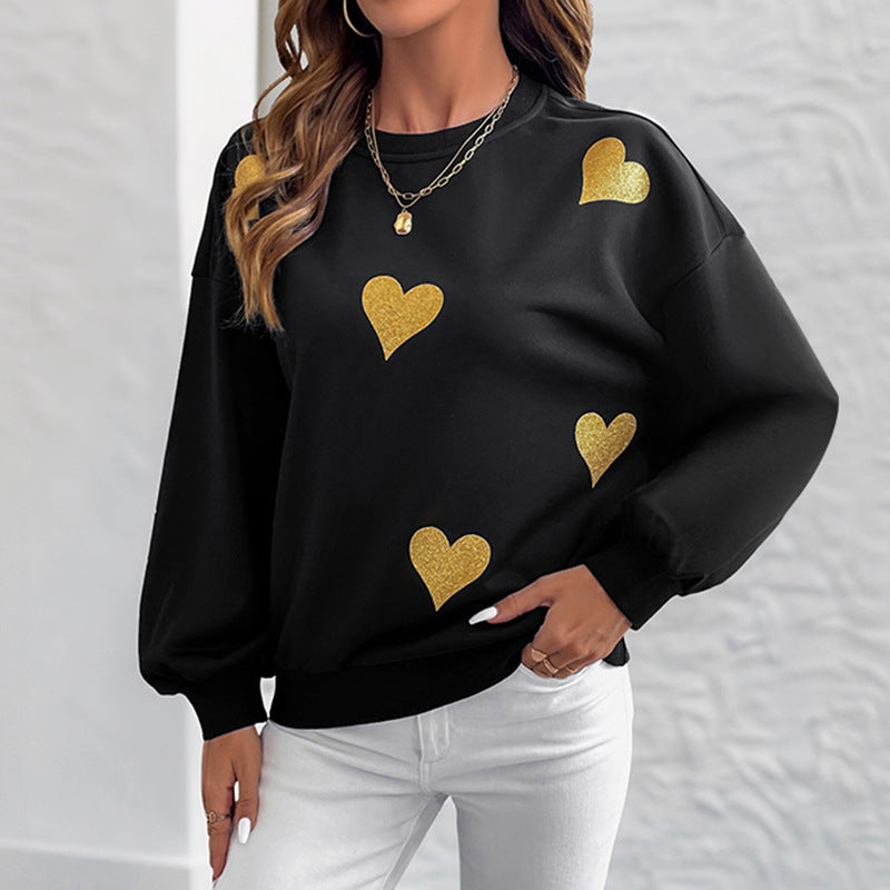 Kvinnors mode sweatshirt med guldhjärta tryck Mirla-Eva Jonsson