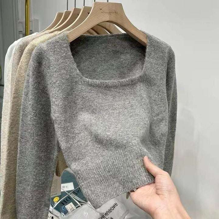 Kvinnors modemedvetna tröja med bred rund halsringning och fin textur Mirla-Eva Jonsson