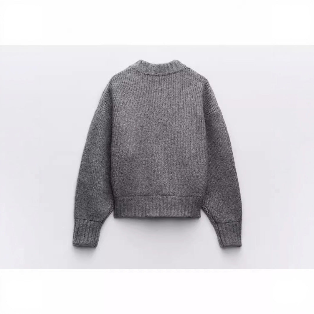 Kvinnors moderna cardigan med voluminösa ärmar och dragkedja Mirla-Eva Jonsson