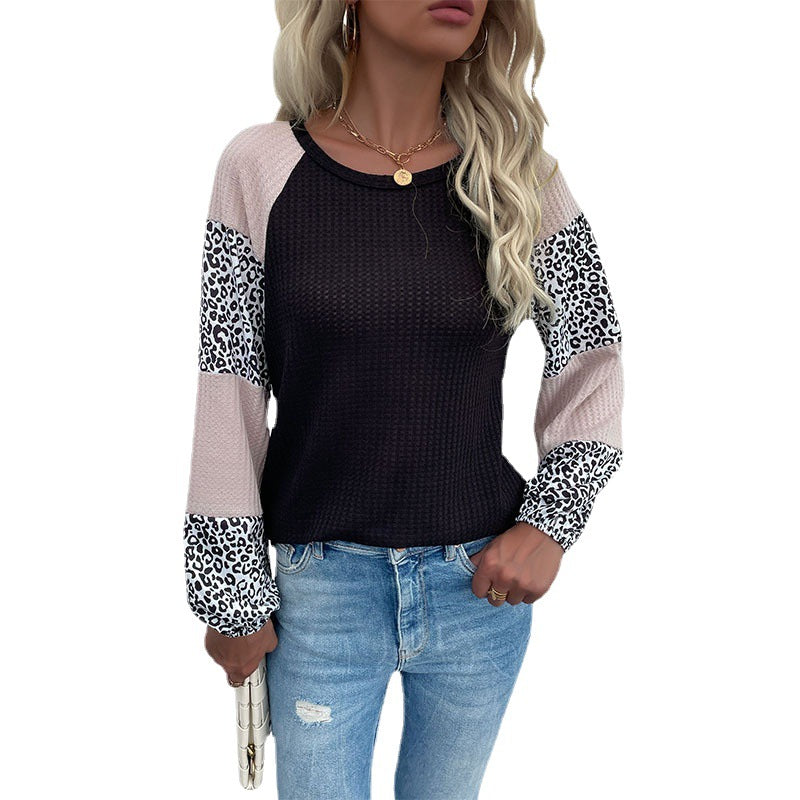 Kvinnors moderna topp med djurmönster och eleganta puffärmar Mirla-Eva Jonsson