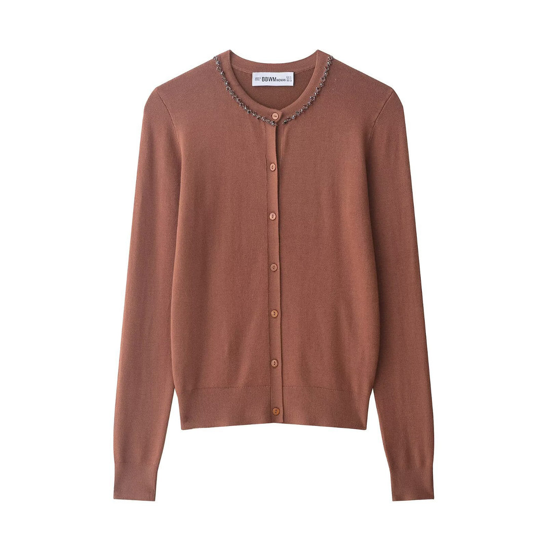 Kvinnors modiga stickad cardigan med elegant pärlutsmyckning Mirla-Eva Jonsson