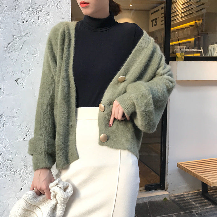 Kvinnors mysiga kofta med stora knappar och oversized passform Mirla-Eva Jonsson