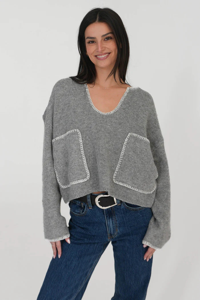 Kvinnors mysiga korta tröja med asymmetrisk design och praktiska fickor Mirla-Eva Jonsson