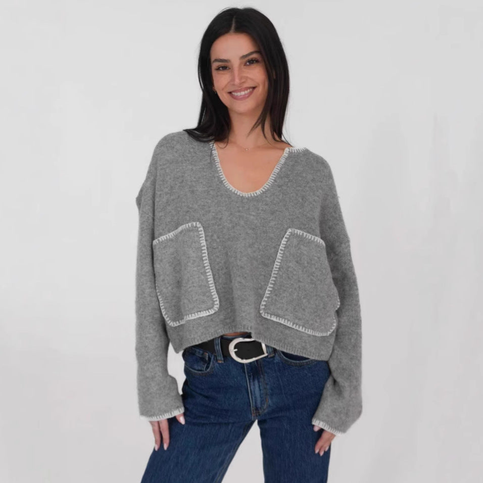 Kvinnors mysiga korta tröja med asymmetrisk design och praktiska fickor Mirla-Eva Jonsson