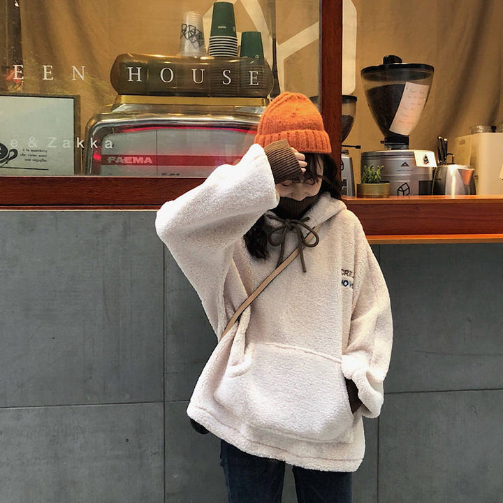 Kvinnors mysiga oversize hoodie med fram kanguroficka och elastiska manschetter Mirla-Eva Jonsson