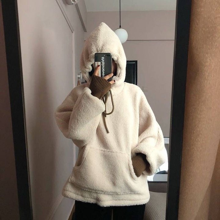 Kvinnors mysiga oversize hoodie med fram kanguroficka och elastiska manschetter Mirla-Eva Jonsson
