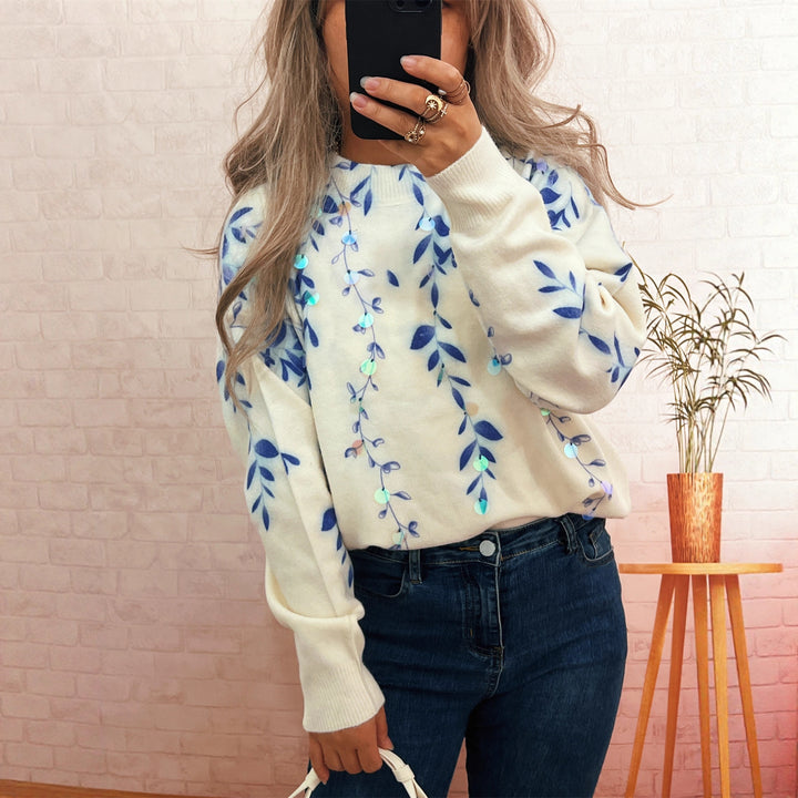 Kvinnors mysiga oversized tröja med blommig applikédesign Mirla-Eva Jonsson