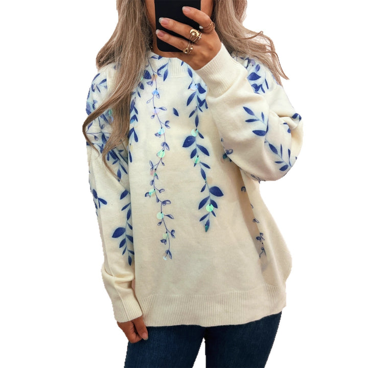 Kvinnors mysiga oversized tröja med blommig applikédesign Mirla-Eva Jonsson