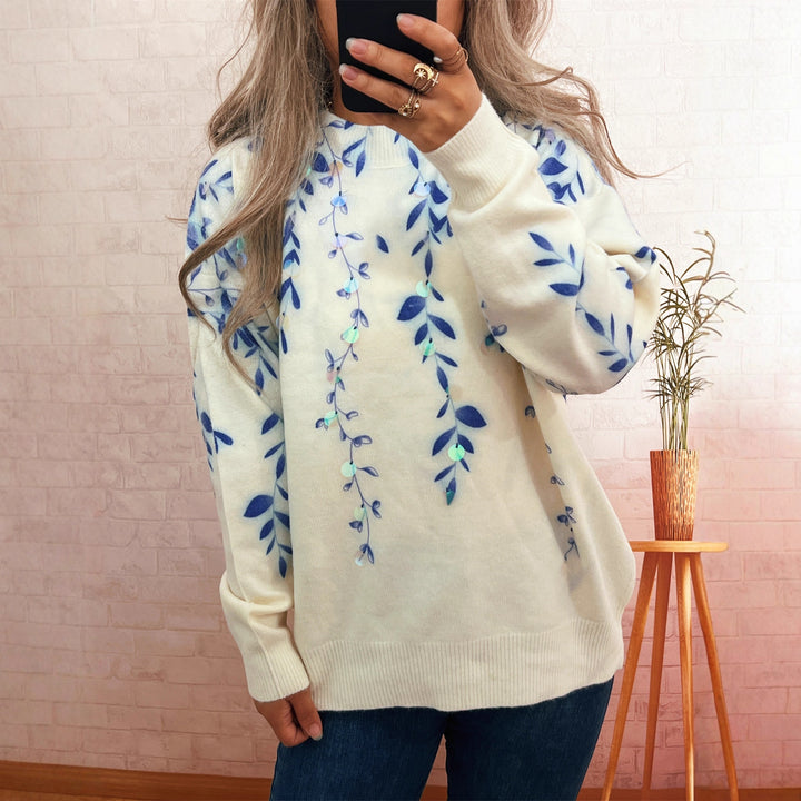 Kvinnors mysiga oversized tröja med blommig applikédesign Mirla-Eva Jonsson