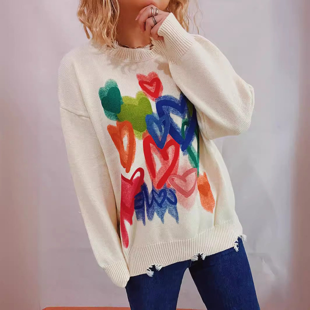 Kvinnors mysiga tröja med färgglad hjärtdesign Mirla-Eva Jonsson