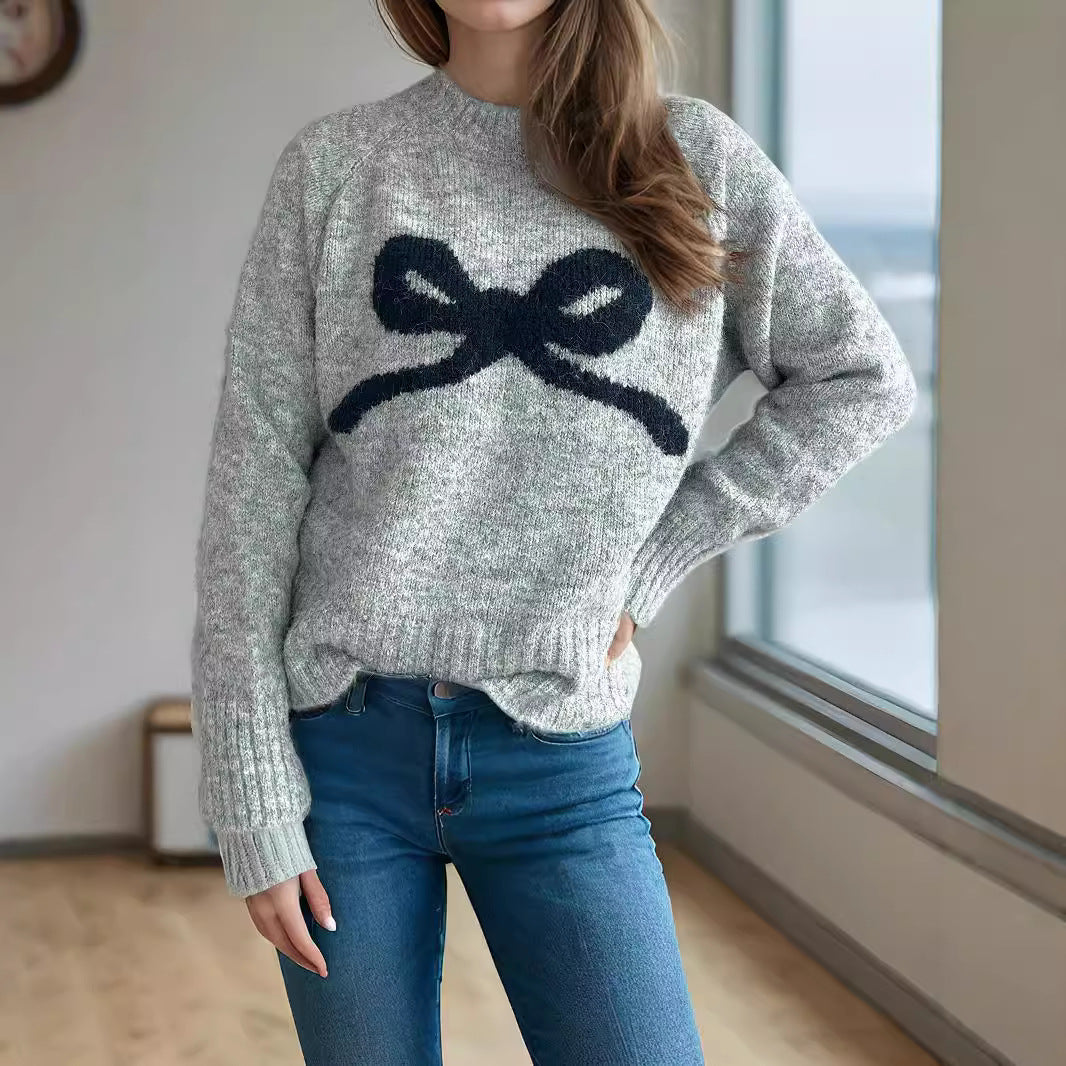 Kvinnors mysiga tröja med rosettmotiv Mirla-Eva Jonsson