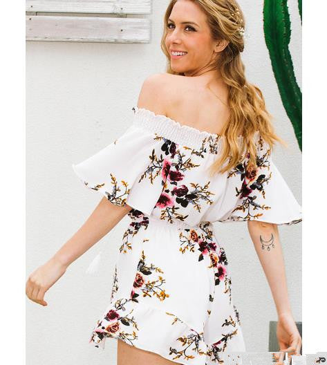 Kvinnors off-shoulder playsuit med blommig design och volangdetaljer Mirla-Eva Jonsson