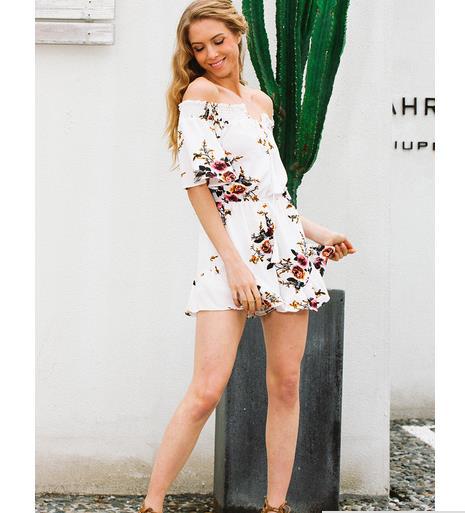 Kvinnors off-shoulder playsuit med blommig design och volangdetaljer Mirla-Eva Jonsson