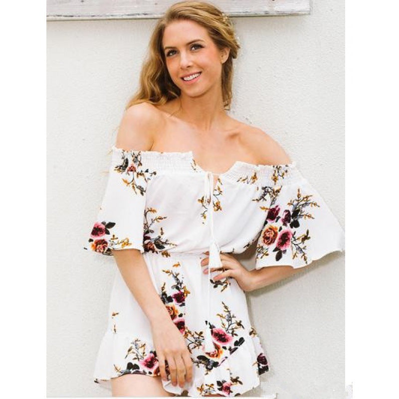 Kvinnors off-shoulder playsuit med blommig design och volangdetaljer Mirla-Eva Jonsson