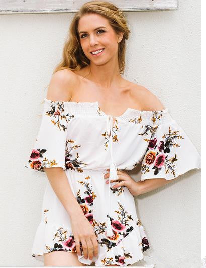 Kvinnors off-shoulder playsuit med blommig design och volangdetaljer Mirla-Eva Jonsson