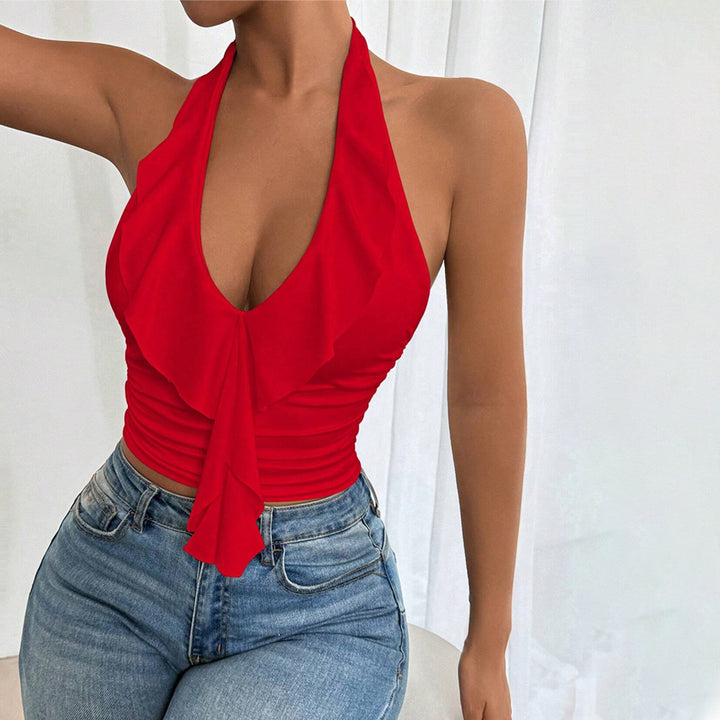 Kvinnors off-shoulder topp med flödande tyg och elegant volangdesign Mirla-Eva Jonsson