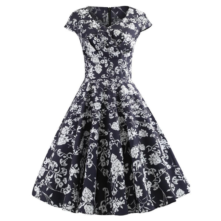 Kvinnors omslagsklänning med elegant blommönster och smickrande skärning Mirla-Eva Jonsson