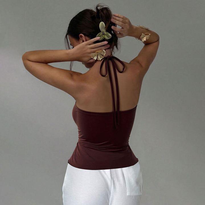 Kvinnors omslagstopp med elegant drapering och justerbar nackband Mirla-Eva Jonsson