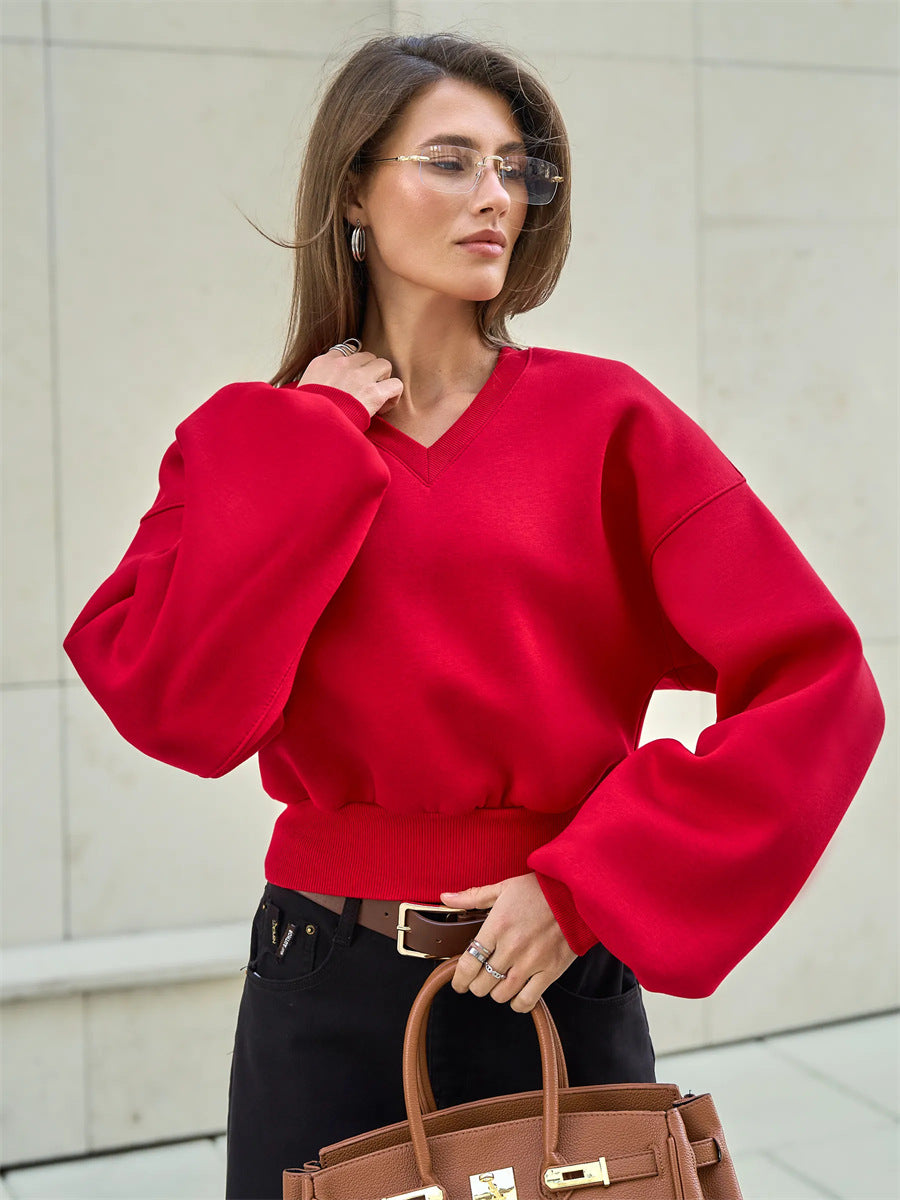 Kvinnors oversized V-hals sweatshirt med voluminösa ärmar Mirla-Eva Jonsson