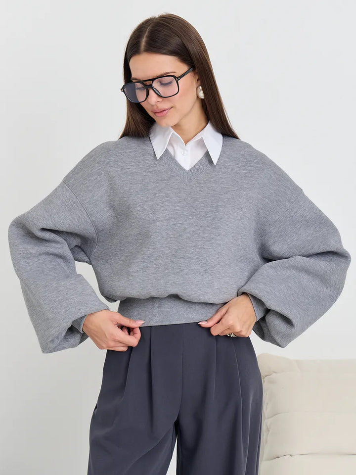 Kvinnors oversized V-hals sweatshirt med voluminösa ärmar Mirla-Eva Jonsson