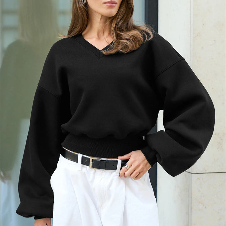 Kvinnors oversized V-hals sweatshirt med voluminösa ärmar Mirla-Eva Jonsson